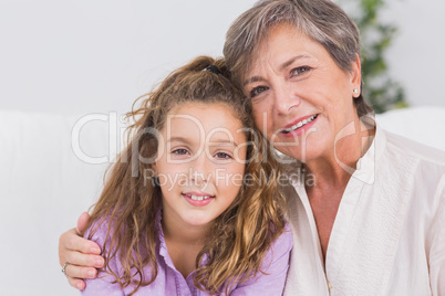 Portrait of a little girl and her grandmother smiling