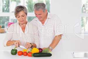 Old couple preparing vegetables