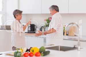 Old couple yelling in the kitchen