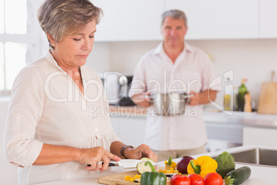 Old couple preparing food