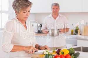 Old couple preparing food