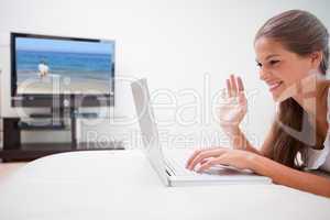 Woman doing video conference in the living room