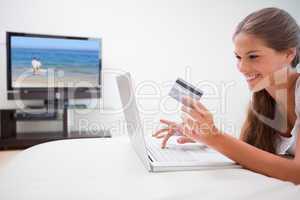 Woman doing online shopping in the living room