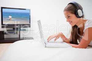 Woman surfing the internet while listening to music
