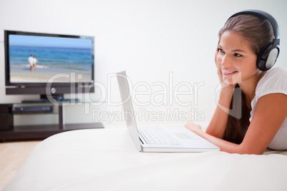Woman browsing the internet while listening to music