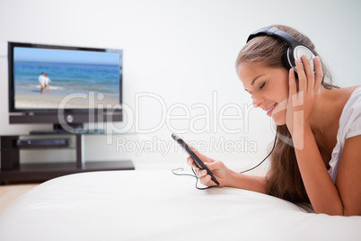 Woman enjoying music in the living room