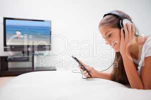 Woman enjoying music in the living room