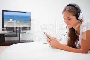 Woman listening to music on her mp3 player