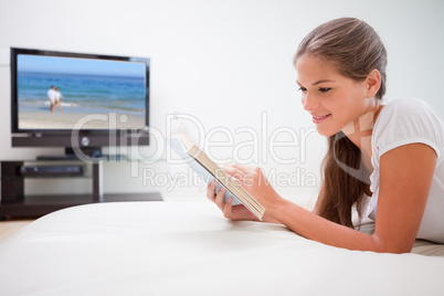 Woman reading novel in the living room