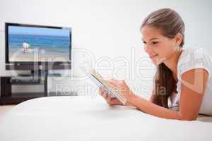 Woman reading novel in the living room