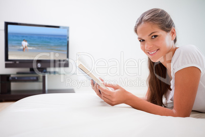 Woman holding book in the living room