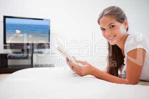 Woman holding book in the living room