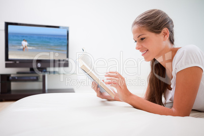 Woman reading book in the living room