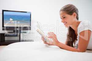 Woman reading book in the living room