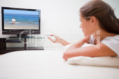 Woman watching television in the living room