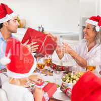 Family exchanging christmas presents