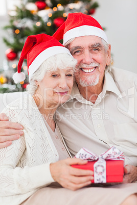 Happy couple on the couch at christmas