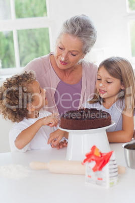 Children making cake with granny