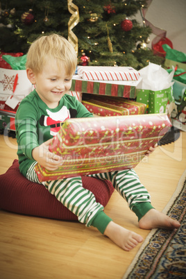 Young Boy Enjoying Christmas Morning Near The Tree