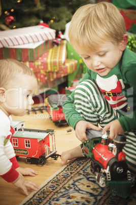 Young Boy Enjoying Christmas Morning Near The Tree