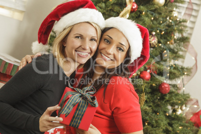 Young Mixed Race Girlfriends with Christmas Gift