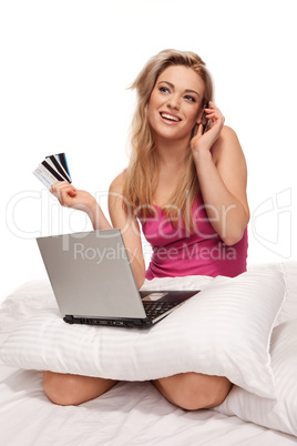 Happy online shopper chatting on her mobile