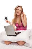 Happy online shopper chatting on her mobile