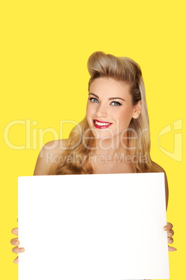 Glamorous blonde woman with a blank sign