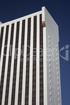 Casino building with blue skies and gold windows.