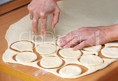 Hands od raw dough preparing pastry