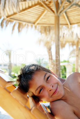 Smiling boy portrait on beach