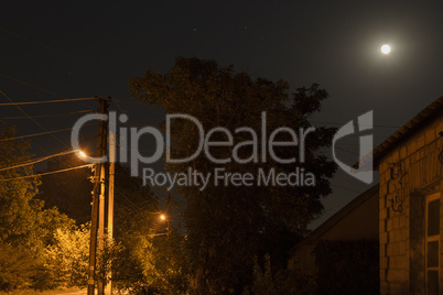 Night Landscape. The moon and the street lamps.