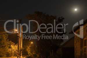 Night Landscape. The moon and the street lamps.