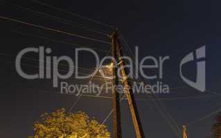 Night Landscape. Street lamps and a butterfly