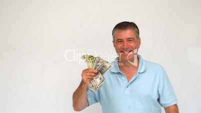Happy man throwing dollars