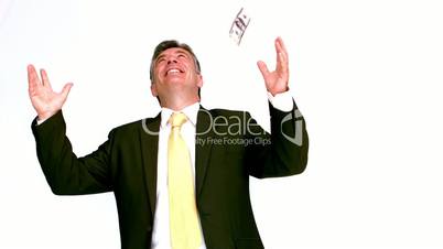 Happy businessman enjoying falling bills