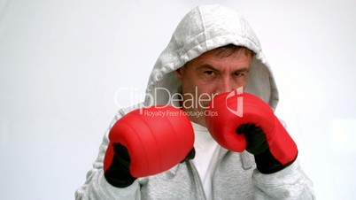 Man in sweatshirt boxing