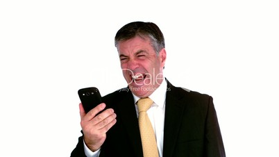 Businessman screaming on mobile phone