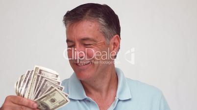 Smiling man waving bills