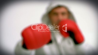 Focus shot on the man punching with red gloves
