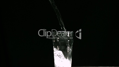 Sparkling water filling a glass