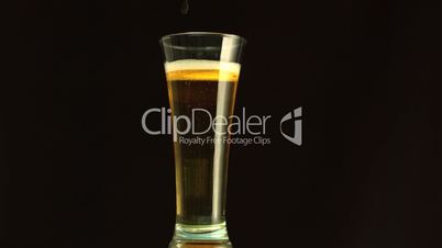 Beer filling a glass