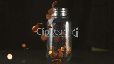 Cents filling up a glass jar