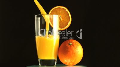 Glass of orange juice being poured