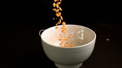 Rice cereal being poured into bowl
