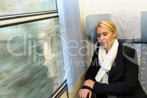 Woman sleeping in train compartment tired resting