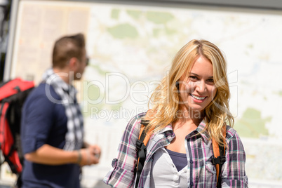 Couple backpack traveling on holiday smiling map