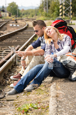 Woman resting on man's shoulder backpack travel