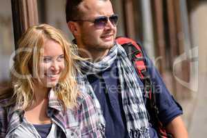 Couple traveling by backpack smiling together trip