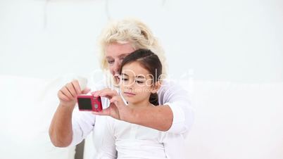 Grandmother taking a picture with his granddaughter